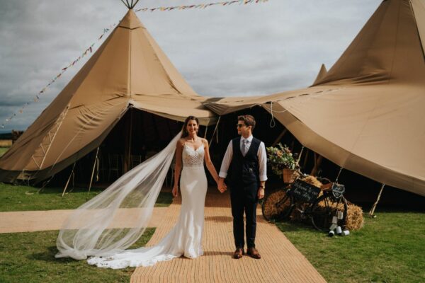 Bride and Groom in front of Event Tipis - Cumbria Tipi Hire - Lake District Wedding Tipi Hire
