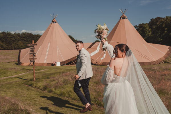 Boho Bride and Groom with their Wedding Tipis. Cumbria Wedding Venue