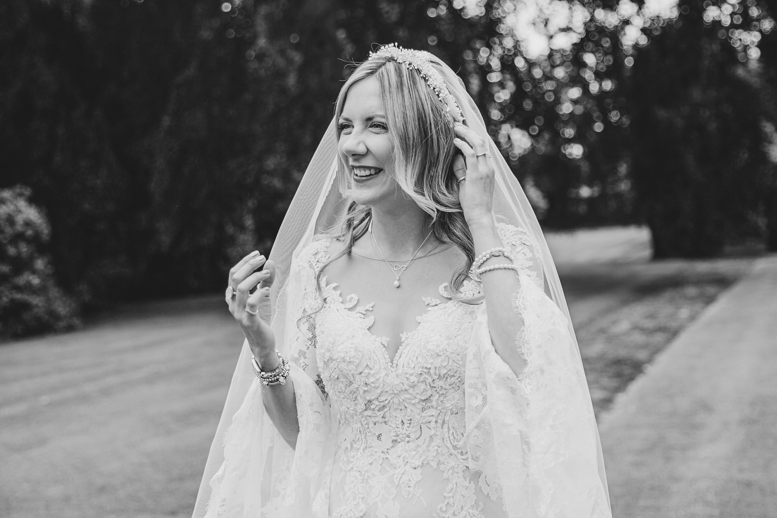Beautiful Bride in lacey wedding dress and beautiful bridal veil