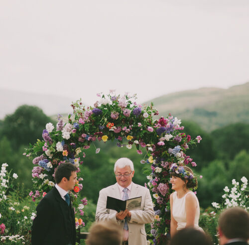 Outside Wedding Ceremony Casterton. Wedding Florist - floral Wedding Arch. Floral Wedding Crown Wedding Celebrant Cumbria, Lake District