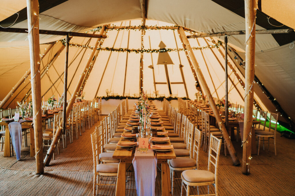Tipi Hire Cumbria - Furniture Hire Cumbria - Long Banquet Style Tables in Giant Hat Tipi
