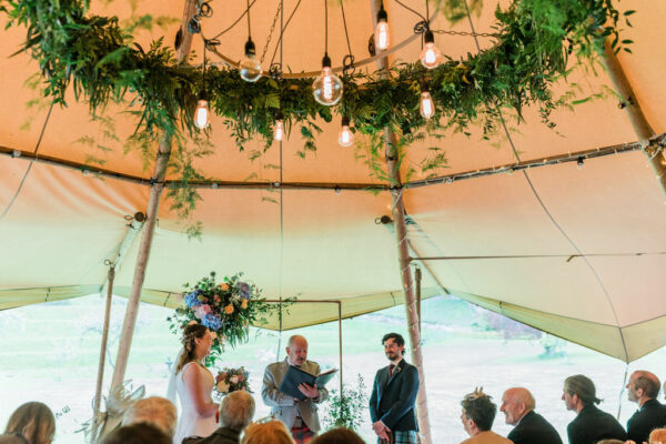 Natural wedding decorations - floral hoop - Edison chandelier - clear panels