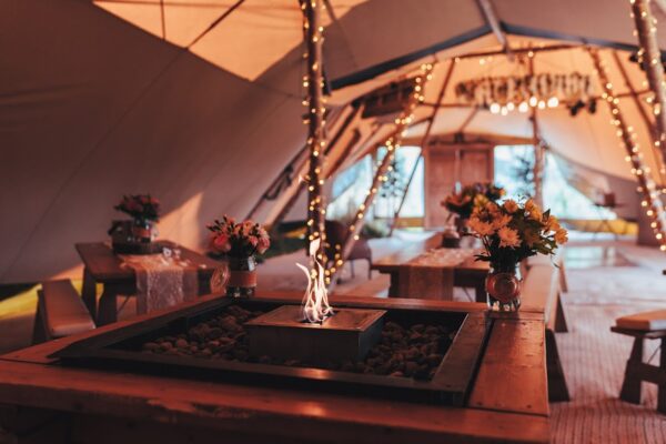 Warm and Cosy Tipi Tents with Fire Pit and Chill Out Furniture and Oak Doors