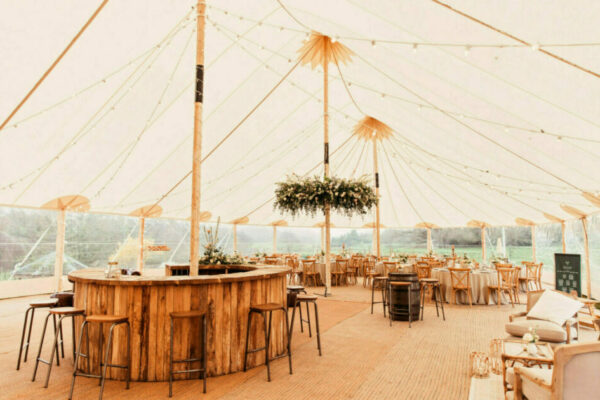 Sailcloth with floral hoop and wooden round bar - Sperry tent with wooden round bar - Sailcloth Tent Event Decorations