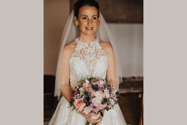 Wedding ready - bride with bouquet - lace wedding dress - wedding veil