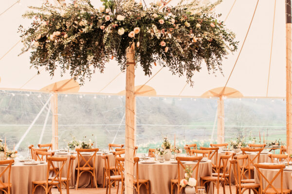 Gorgeous floral hoop in a light, bright and airy sailcloth tent marque