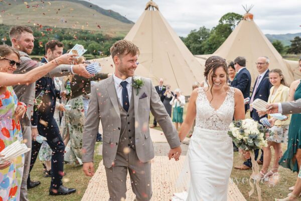 Happy Couple at Threlkeld Cricket Club in the Lake District Tipi Tent Friendly Wedding Venue