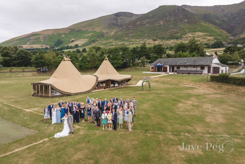 Beautiful Tipi Tents with the Lake District Mountains behind at Lake District Wedding Venue Threlkeld Cricket Club in Cumbria