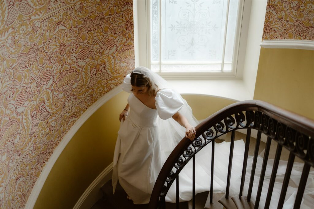 Our bride, Chloe on the dramatic stairs at Silverholme Manor, Lake District wedding venue