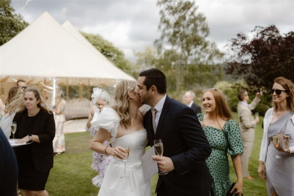 Guests congratulating the bride - Sailcloth Wedding in the Lake District