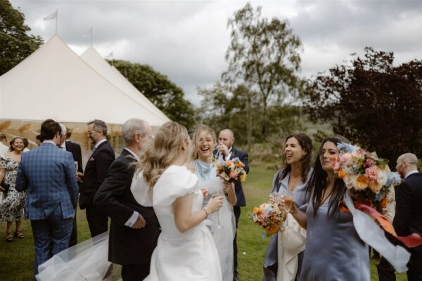 Guests congratulating the bride - Sailcloth Wedding in the Lake District