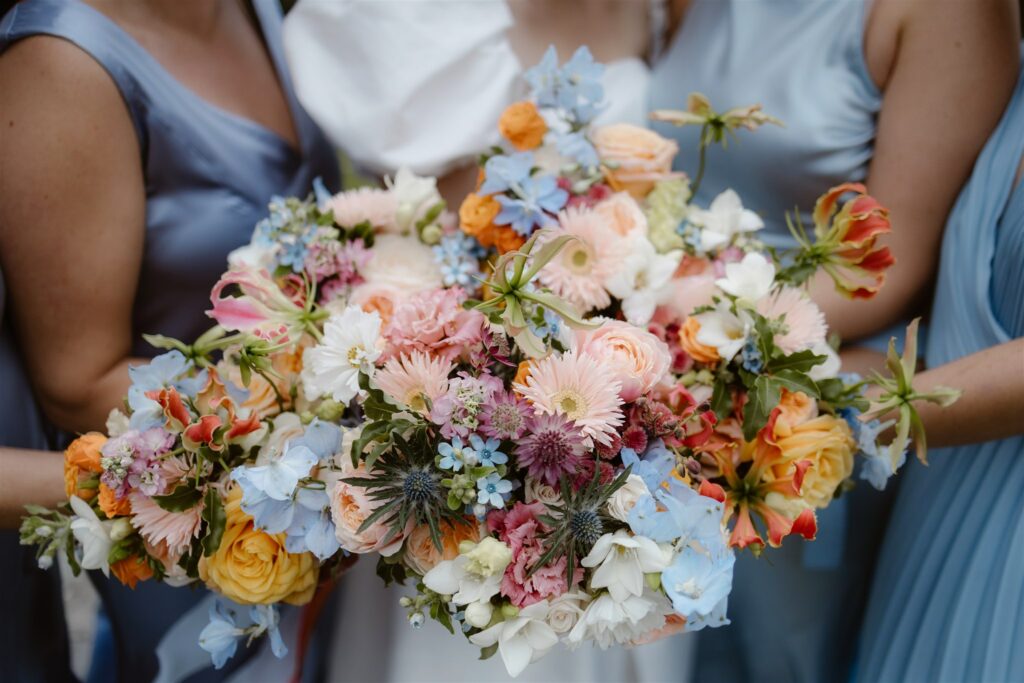 Beautiful Wedding Bouquets and bridesmaids wedding dresses - Sailcloth Marquee wedding in the lake district - Sailcloth Tent Wedding Hire Cumbria. Flowers by Quirky Petal. Jono Symonds Photography