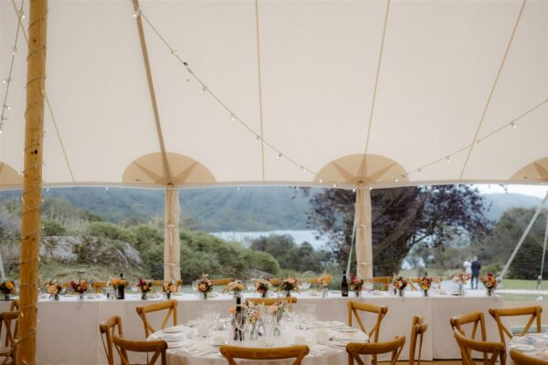 I spy the Bride and Groom through the clear panels in the Sailcloth Marquee, Windermere wedding in the Lake District