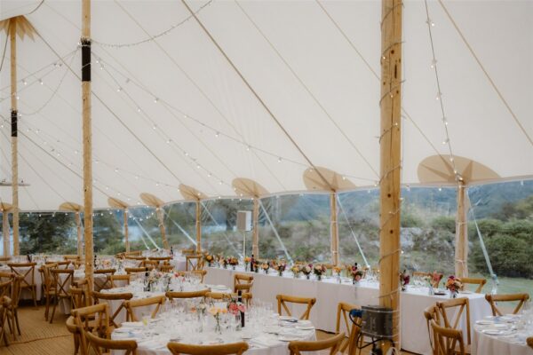 Beautiful Light and Bright Sailcloth Tent with high ceilings and twinkly fairy lighting. Sperry style tent hire in Cumbria