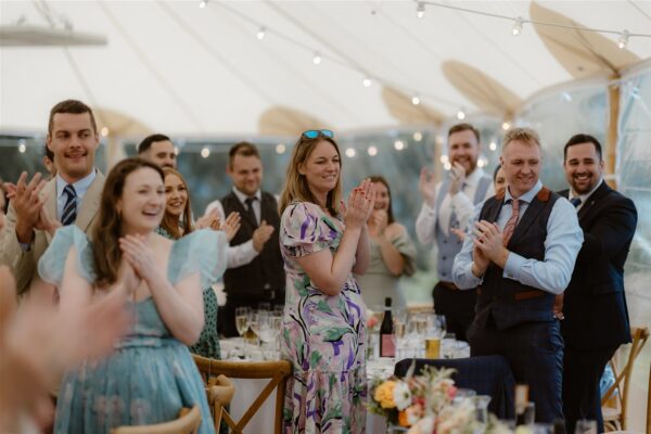 Please be upstanding for Mr and Mrs Evans! Wedding Guests in Sailcloth Marquee. Light and Bright wedding marquee hire cumbria and the lake district