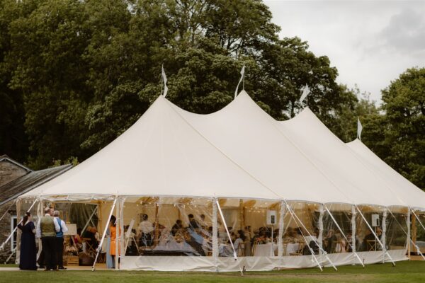 Beautiful Sailcloth Marquee in it's happy place in the Lake District Cumbria. Clear panels on Sailcloth marquee with raised sides.