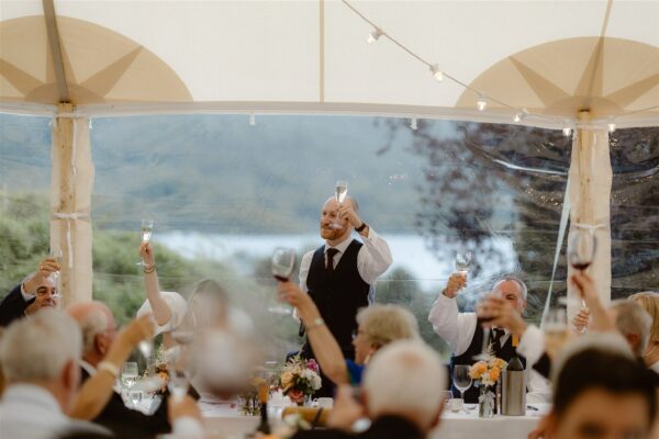 Cheers! Toasting Time - Wedding Speech Time on the Top Table - Wedding Party top table beautiful views from Sailcloth Marquee Tent